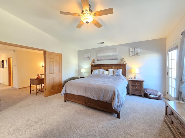 bedroom with light carpet, ceiling fan, vaulted ceiling, and visible vents