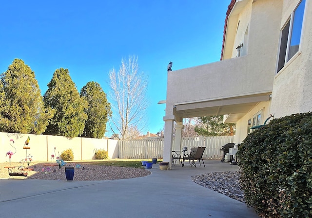 view of patio featuring a fenced backyard and grilling area