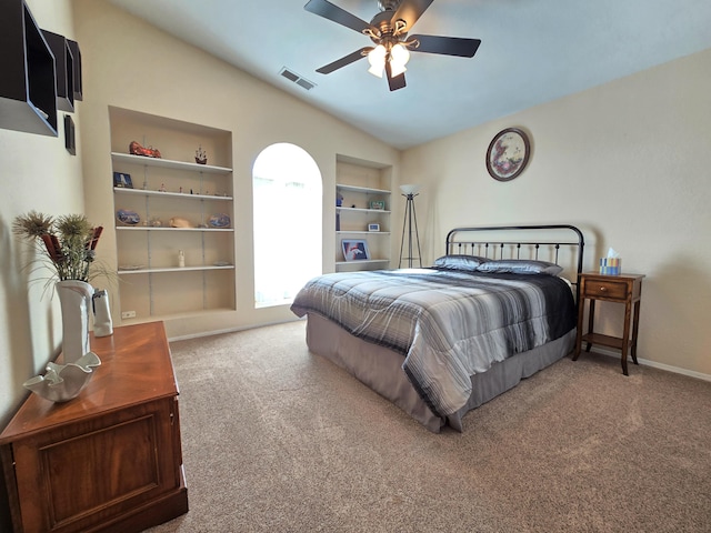 carpeted bedroom with ceiling fan, baseboards, visible vents, and vaulted ceiling