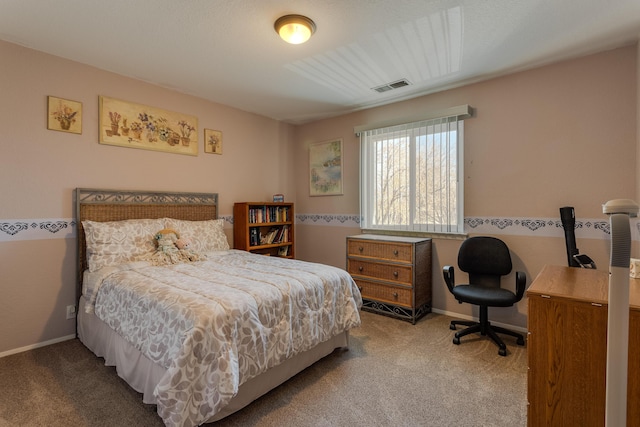 carpeted bedroom featuring visible vents and baseboards