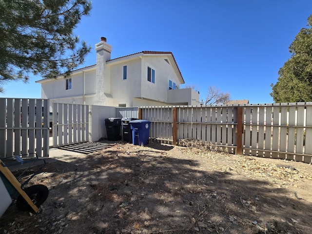 view of yard featuring fence and a gate