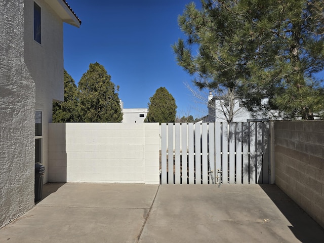 view of gate featuring fence