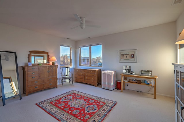 bedroom featuring light carpet, ceiling fan, and visible vents