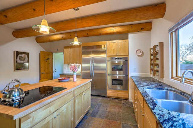 5524 Poblanos Ct NW, Albuquerque, NM 87107 - kitchen featuring stainless steel appliances, butcher block counters, stone finish floors, pendant lighting, and a kitchen island
