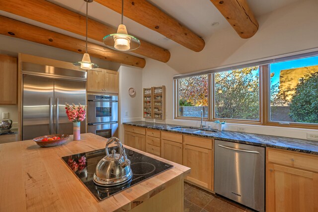 5524 Poblanos Ct NW, Albuquerque, NM 87107 - kitchen featuring appliances with stainless steel finishes, light brown cabinetry, butcher block countertops, beamed ceiling, and pendant lighting