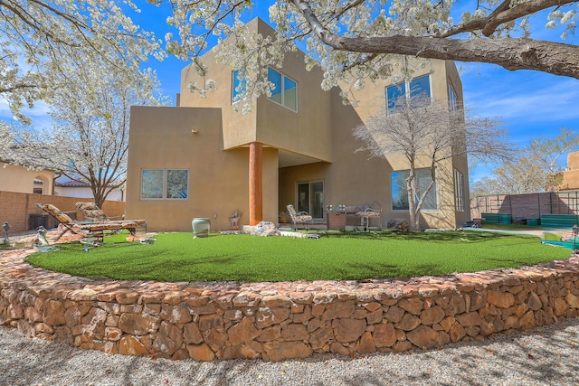 5524 Poblanos Ct NW, Albuquerque, NM 87107 - rear view of property featuring stucco siding and a patio area