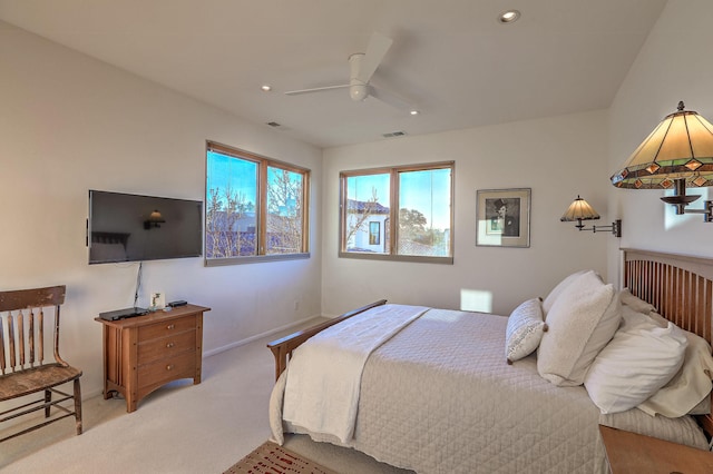 bedroom with a ceiling fan, recessed lighting, light colored carpet, and baseboards