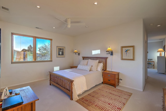 bedroom with light carpet, visible vents, and recessed lighting