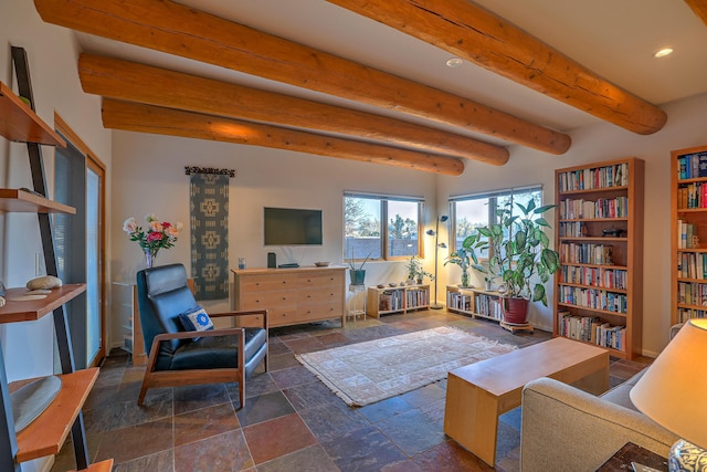 interior space with stone tile floors, baseboards, beam ceiling, and recessed lighting