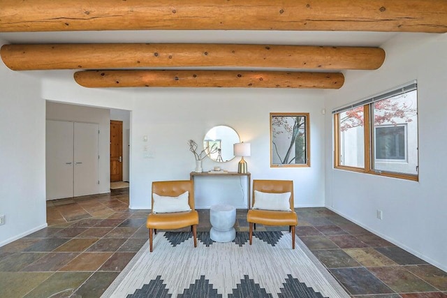 5524 Poblanos Ct NW, Albuquerque, NM 87107 - sitting room with stone tile flooring and beamed ceiling