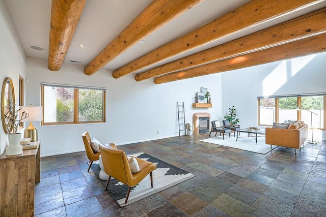 5524 Poblanos Ct NW, Albuquerque, NM 87107 - living room with stone tile flooring, recessed lighting, and beam ceiling