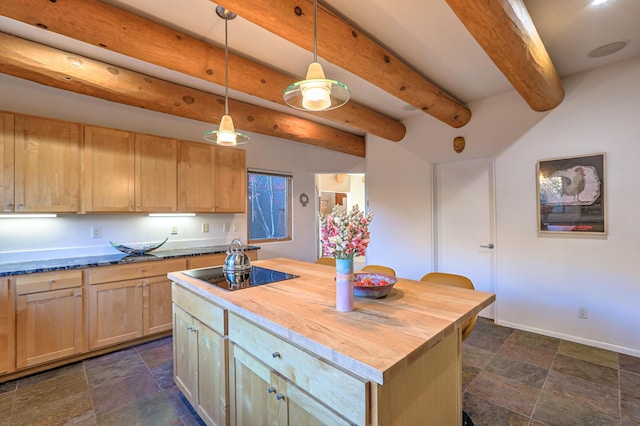 kitchen featuring light brown cabinets, butcher block countertops, black electric stovetop, and stone finish flooring