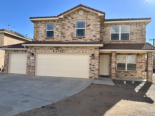 traditional-style home with an attached garage and driveway