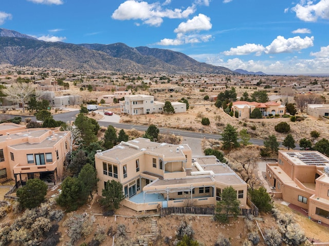 birds eye view of property with a residential view and a mountain view