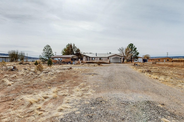 view of front of property featuring a garage and driveway