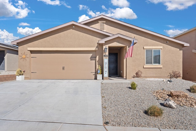 ranch-style house with concrete driveway, an attached garage, and stucco siding