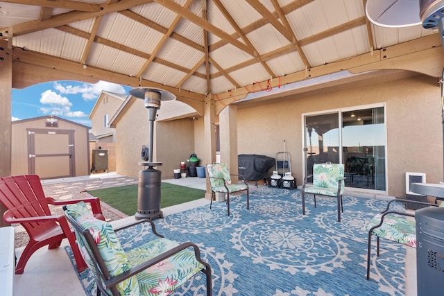 view of patio / terrace featuring a storage shed, an outdoor structure, and a gazebo