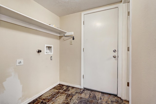 laundry room featuring laundry area, washer hookup, electric dryer hookup, and baseboards