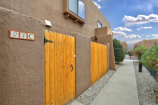 view of gate featuring fence