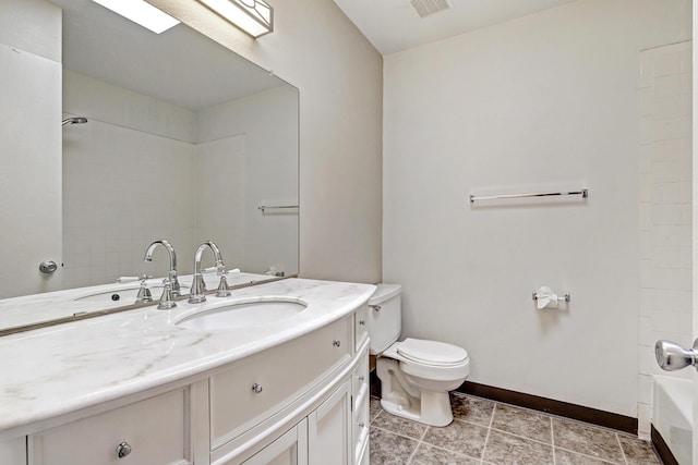 bathroom featuring visible vents, vanity, toilet, and baseboards