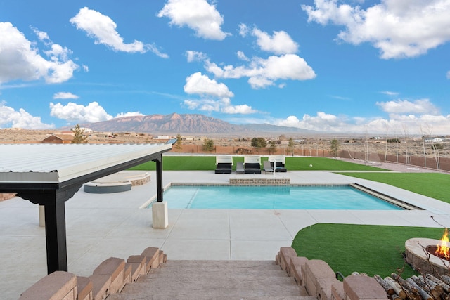 6316 La Paz Rd NE, Rio Rancho, NM 87144 - swimming pool featuring an outdoor fire pit, a mountain view, and a patio area