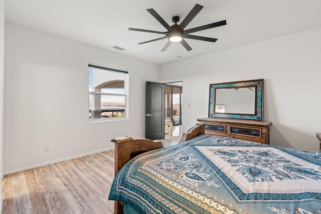 6316 La Paz Rd NE, Rio Rancho, NM 87144 - bedroom with wood finished floors, baseboards, and ceiling fan