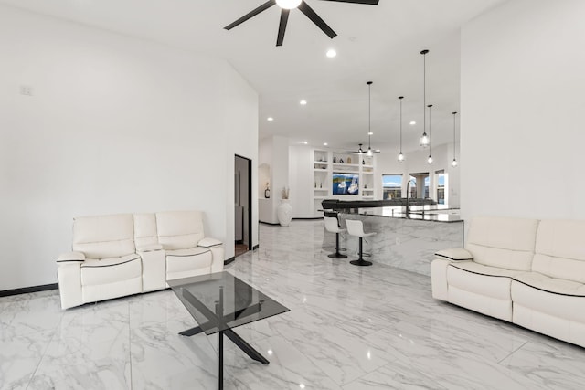 6316 La Paz Rd NE, Rio Rancho, NM 87144 - living room featuring ceiling fan, marble tiled flooring, and recessed lighting