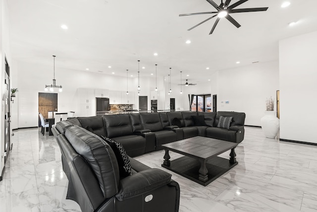 6316 La Paz Rd NE, Rio Rancho, NM 87144 - living room featuring a ceiling fan, light marble finish floors, recessed lighting, and baseboards