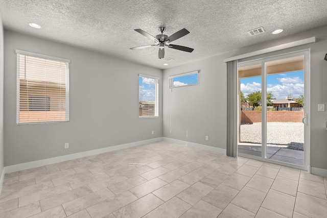 392 Pecos Loop SE, Rio Rancho, NM 87124 - spare room featuring a ceiling fan, a textured ceiling, baseboards, recessed lighting, and light tile patterned floors