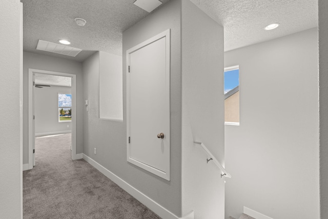 392 Pecos Loop SE, Rio Rancho, NM 87124 - hall featuring a textured ceiling, an upstairs landing, carpet, baseboards, and recessed lighting
