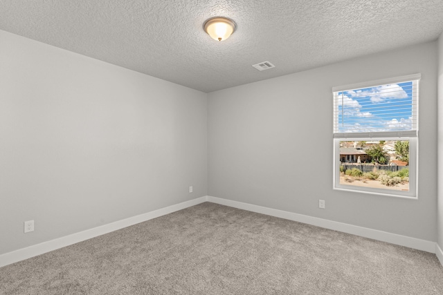 392 Pecos Loop SE, Rio Rancho, NM 87124 - empty room featuring carpet floors, a textured ceiling, and baseboards
