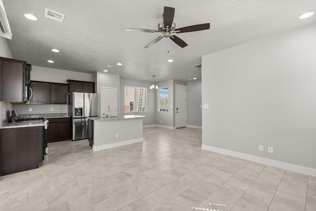 392 Pecos Loop SE, Rio Rancho, NM 87124 - kitchen featuring stainless steel appliances, a textured ceiling, a ceiling fan, dark brown cabinets, and recessed lighting