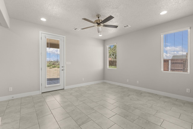 392 Pecos Loop SE, Rio Rancho, NM 87124 - empty room featuring a ceiling fan, a textured ceiling, recessed lighting, baseboards, and light tile patterned flooring