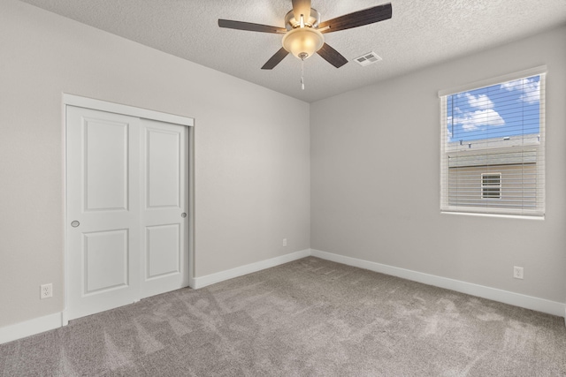 392 Pecos Loop SE, Rio Rancho, NM 87124 - carpeted spare room featuring ceiling fan, a textured ceiling, and baseboards