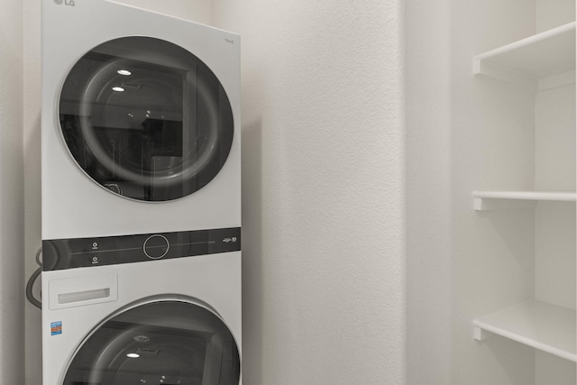 392 Pecos Loop SE, Rio Rancho, NM 87124 - clothes washing area with stacked washer and clothes dryer