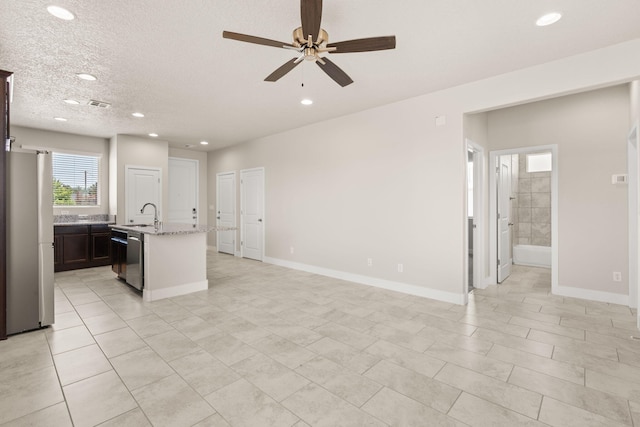 392 Pecos Loop SE, Rio Rancho, NM 87124 - kitchen featuring appliances with stainless steel finishes, open floor plan, a sink, recessed lighting, and ceiling fan
