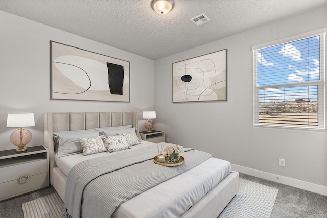392 Pecos Loop SE, Rio Rancho, NM 87124 - bedroom with carpet flooring, baseboards, and a textured ceiling
