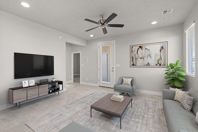392 Pecos Loop SE, Rio Rancho, NM 87124 - living room featuring ceiling fan, recessed lighting, a textured ceiling, baseboards, and light tile patterned flooring