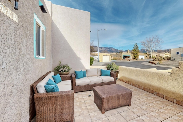 view of patio / terrace featuring a residential view and an outdoor living space