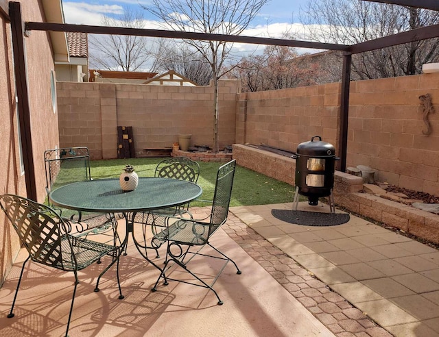 view of patio / terrace with outdoor dining area and a fenced backyard