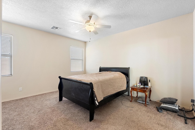 1735 Garden Way SW, Albuquerque, NM 87105 - bedroom with a textured ceiling, a ceiling fan, visible vents, and light colored carpet