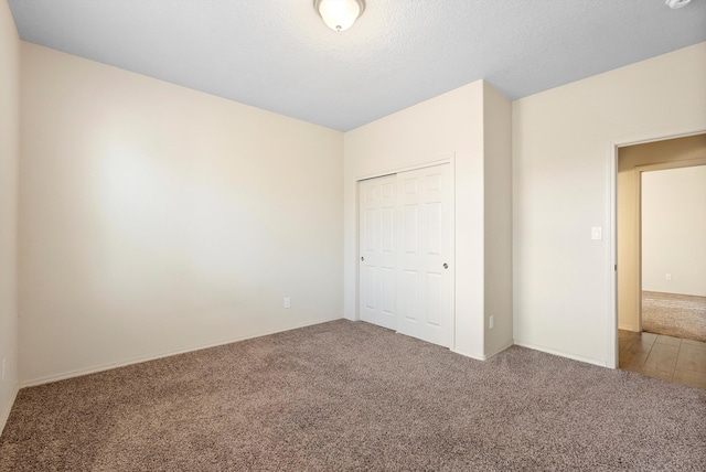 1735 Garden Way SW, Albuquerque, NM 87105 - unfurnished bedroom with a textured ceiling, a closet, and carpet flooring