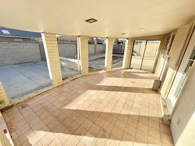 view of patio / terrace featuring fence