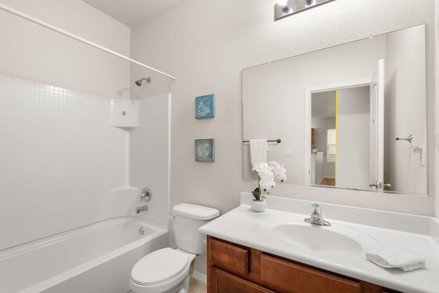 bathroom with shower / bathing tub combination, vanity, and toilet