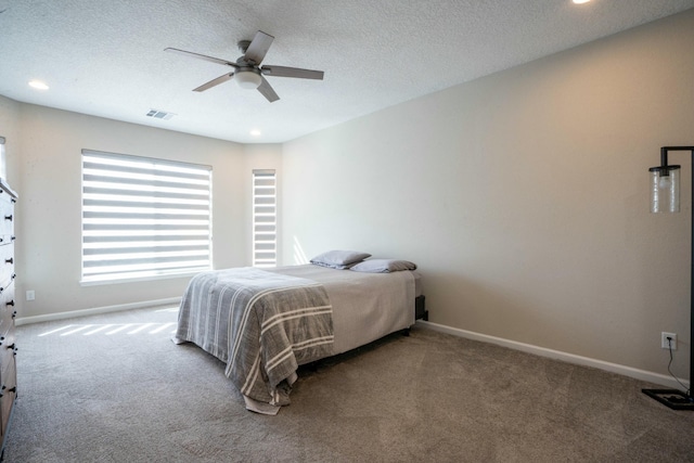 bedroom featuring carpet, visible vents, and baseboards