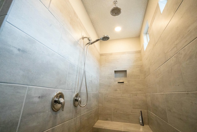 bathroom with a tile shower