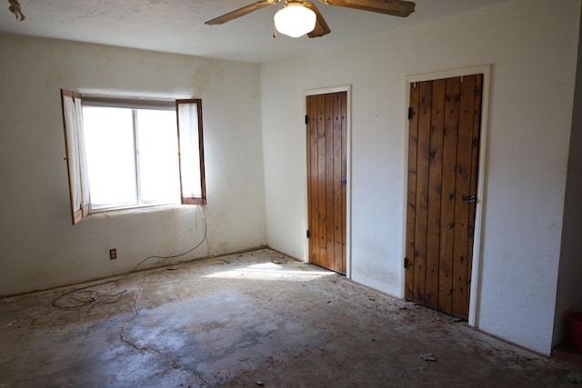 unfurnished bedroom featuring ceiling fan