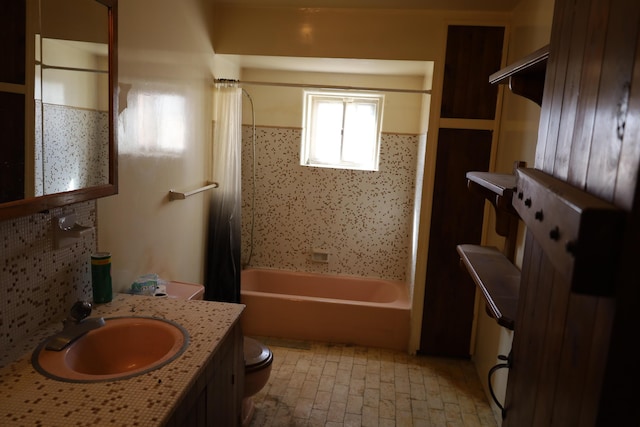 bathroom with brick floor, vanity, toilet, and shower / tub combo with curtain