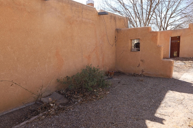 view of side of property with stucco siding