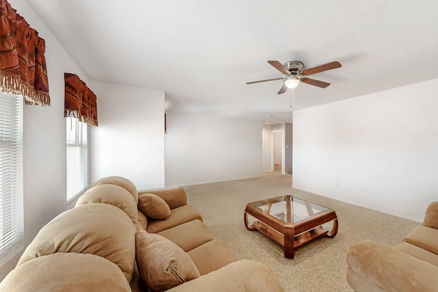 living room featuring light carpet and ceiling fan